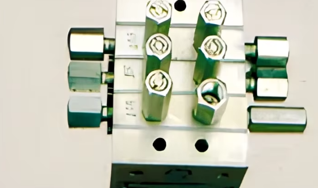 Close-up of precision-machined mould block fittings