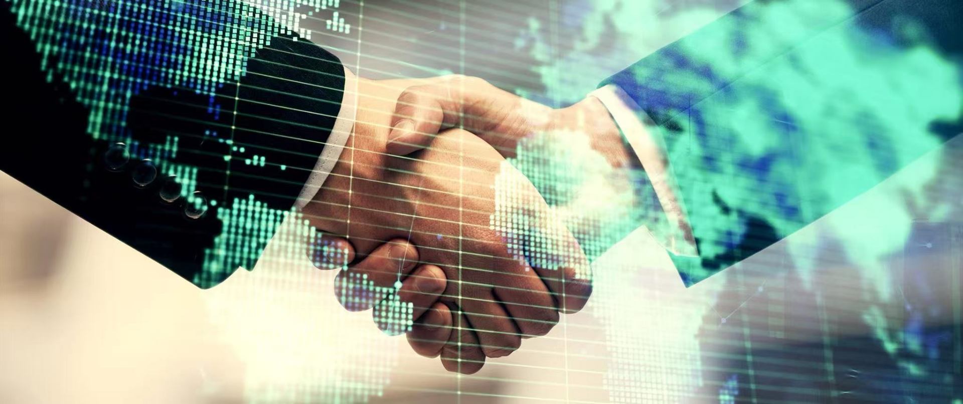 Global business partnership handshake over world map