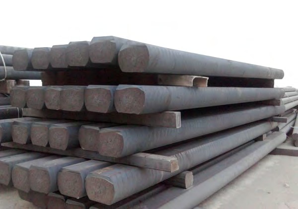 Stacked gray and ductile continuous cast iron bars showing machined end faces