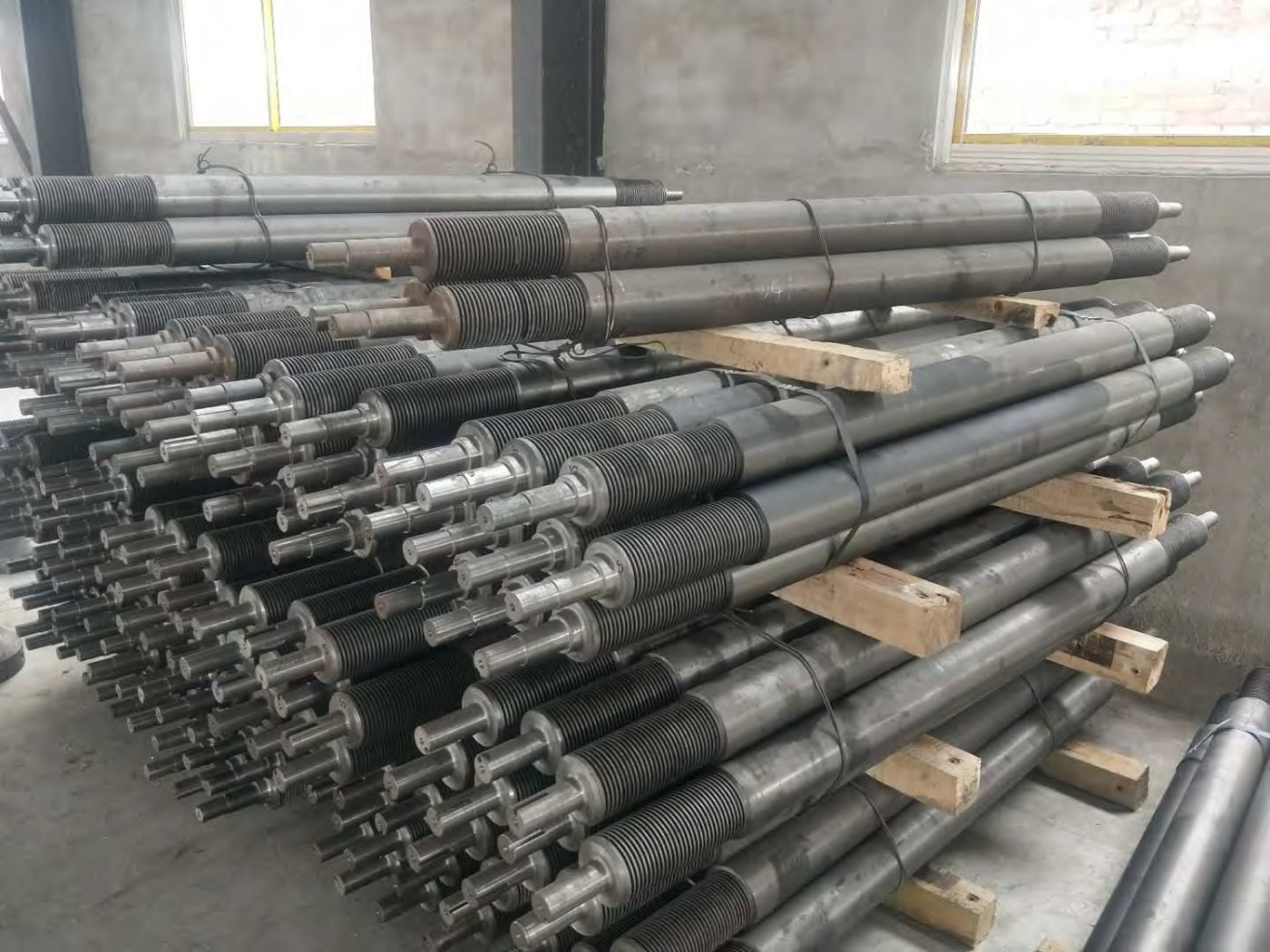 Batch of CNC machined shafts produced from continuous cast iron bar