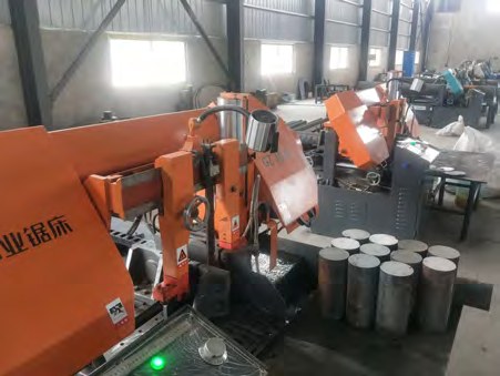 CNC lathe cell machining ductile iron bar stock